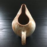 Beige stoneware pitcher with white drips