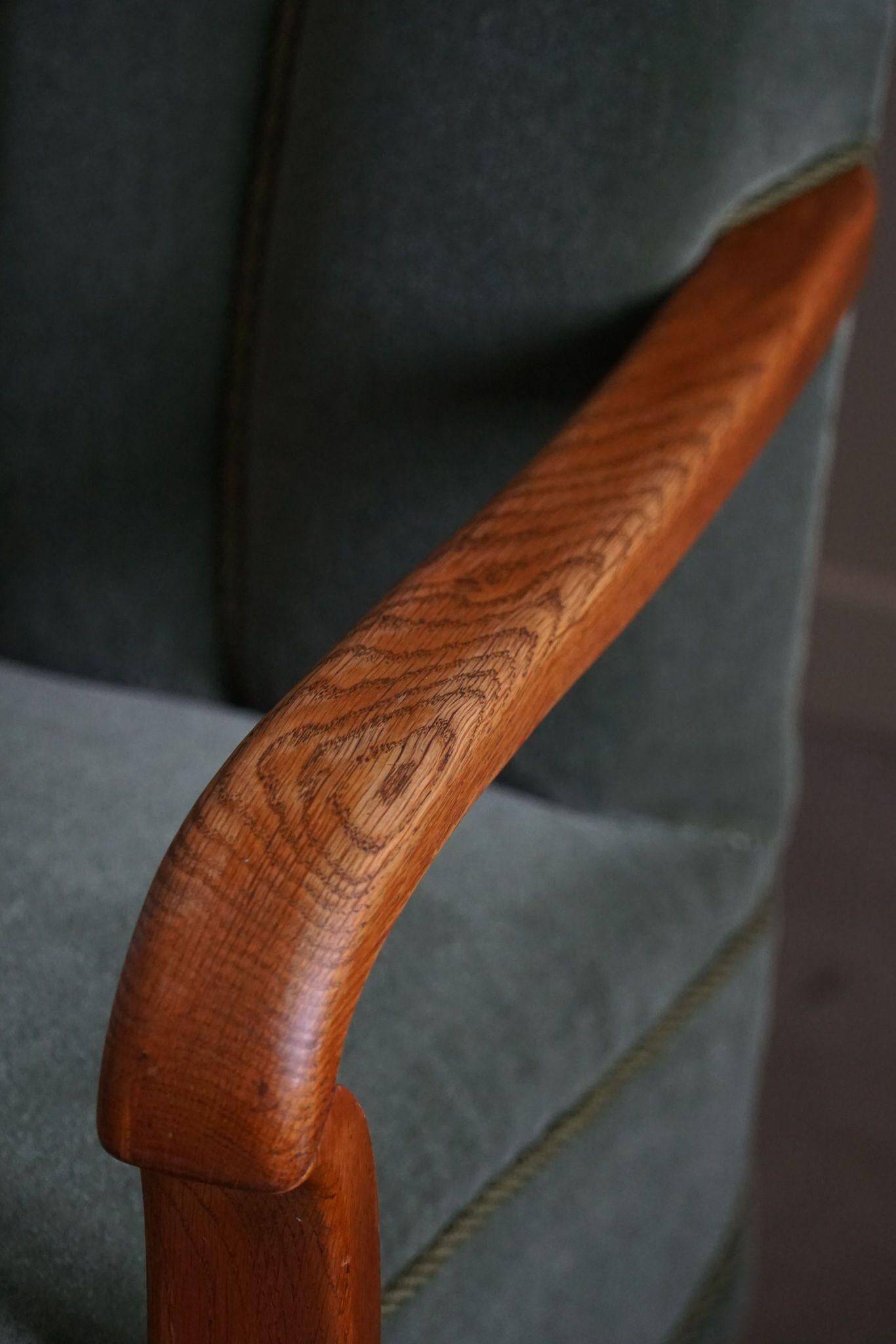 Danish Art Deco, set of 3 oak armchairs, reupholstered in green mohair, 1930s.