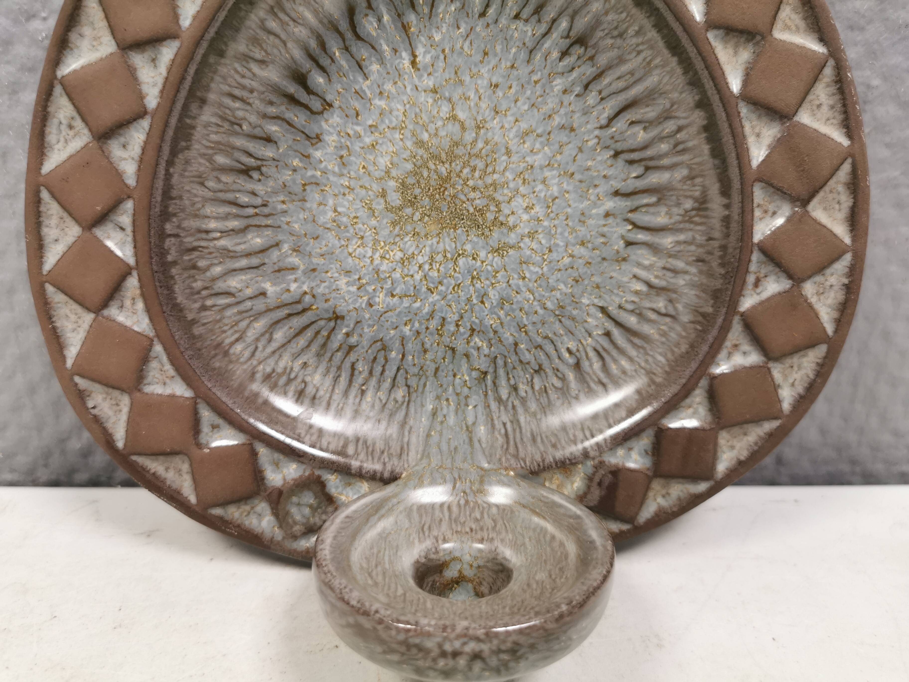 Wall-mounted candlestick in grayish colors, Danish and from the 1970s-80s.