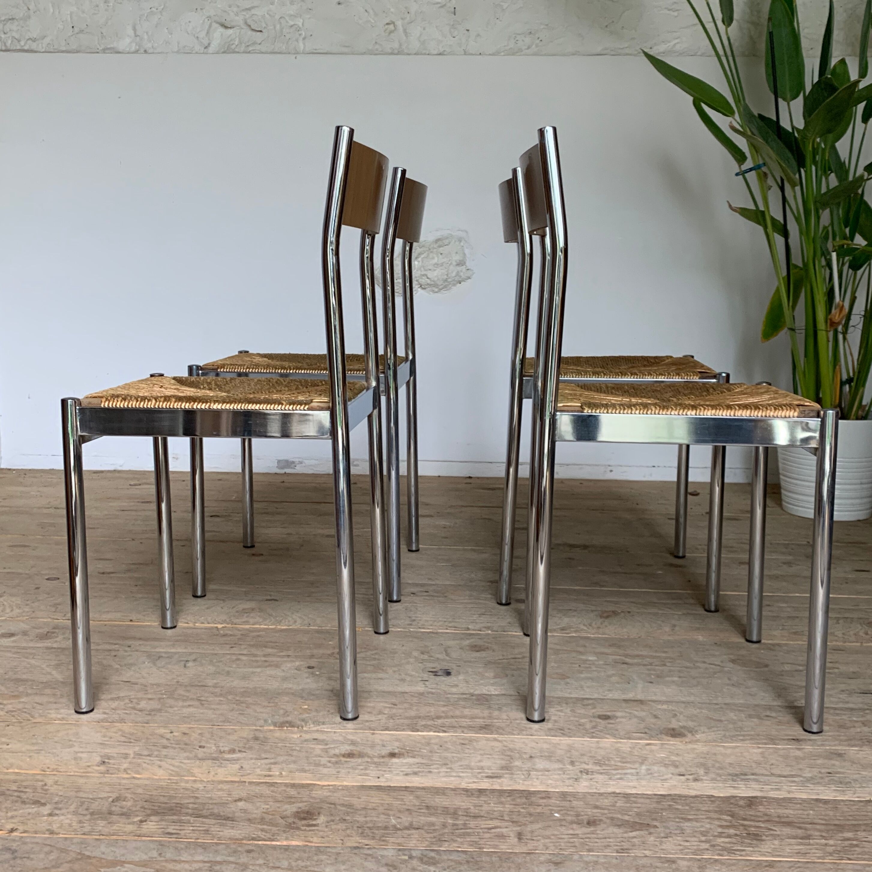 4 chrome and straw chairs
