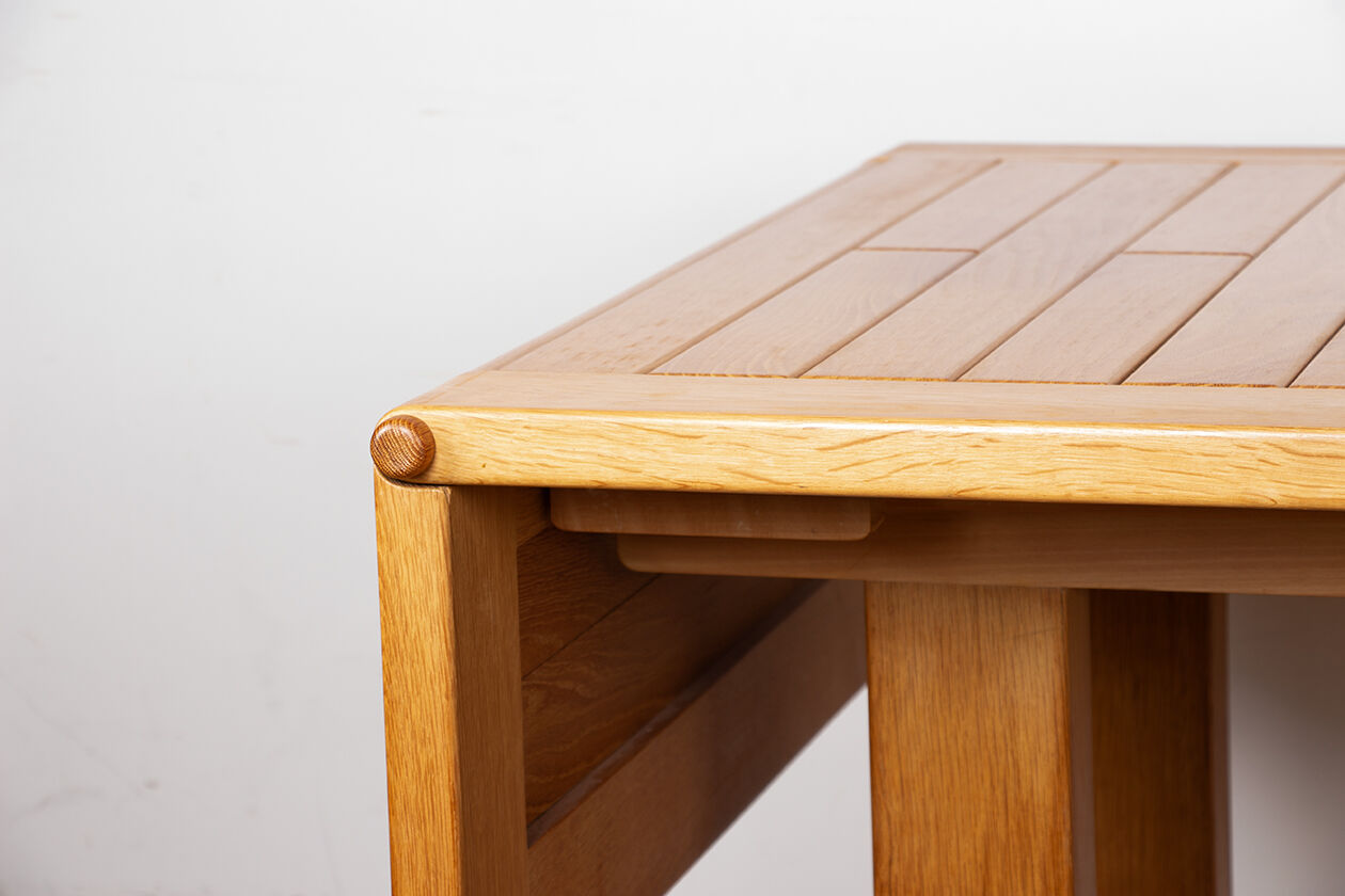 Large extendable dining table in solid oak by Guillerme and Chambron.
