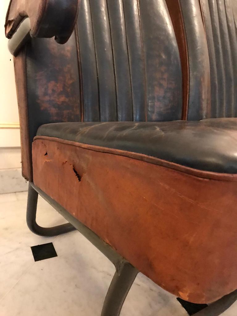 Vintage 1950s leather double-plane bus armchairs