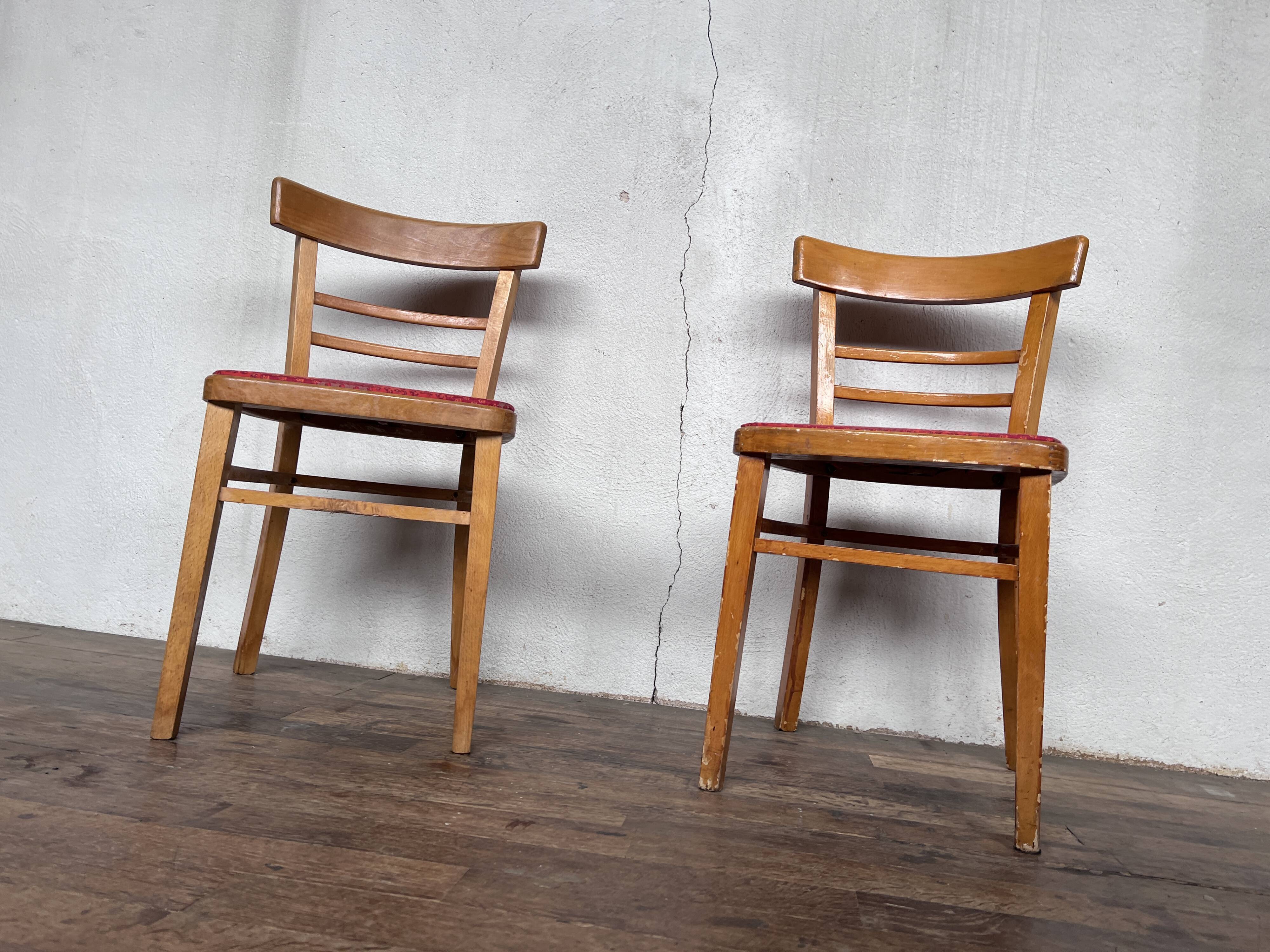 Pair of chairs in light wood and vintage red fabric 1960