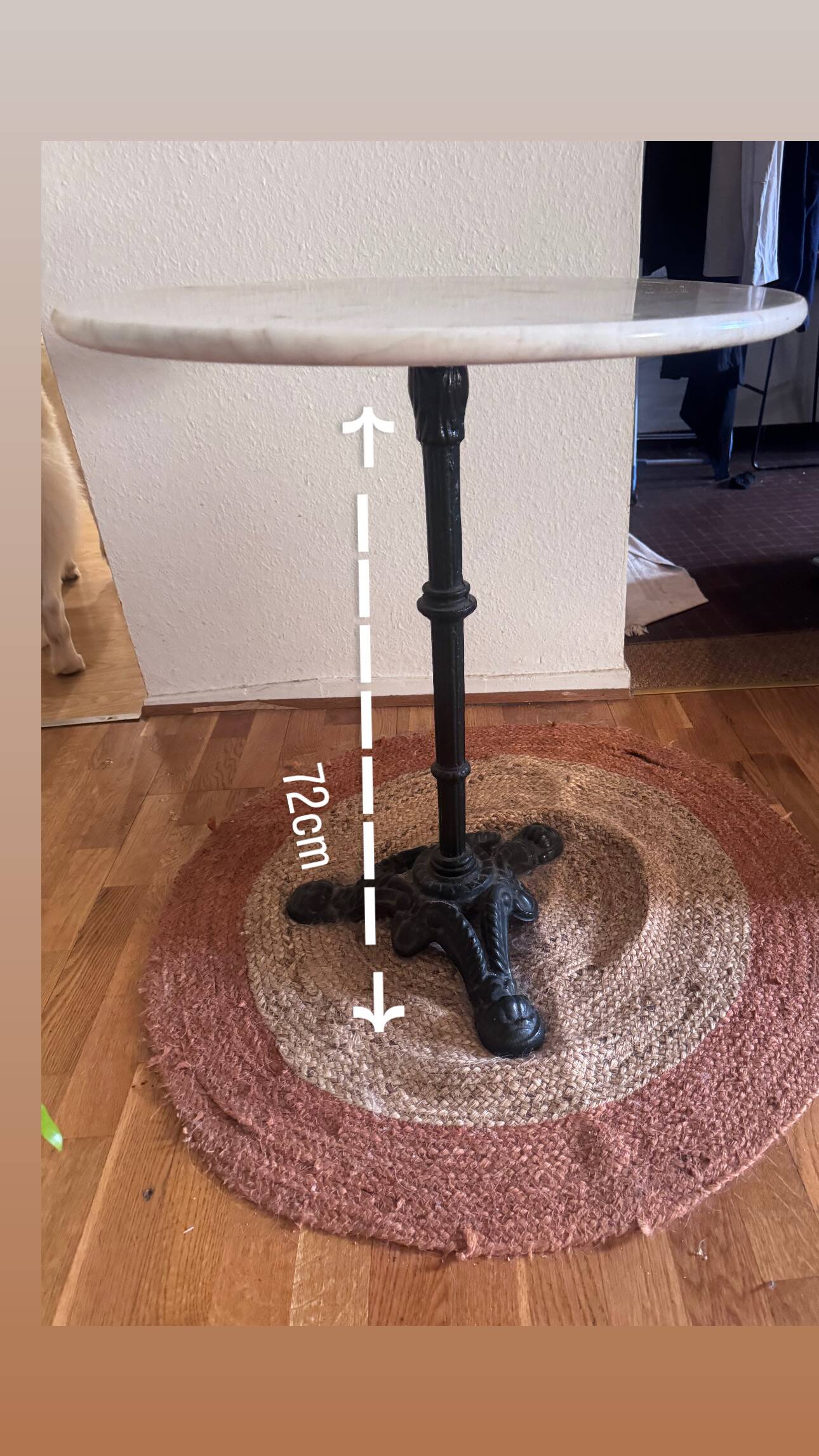 Marble side table with a cast iron base.