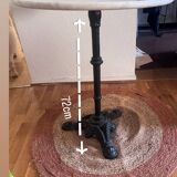 Marble side table with a cast iron base.