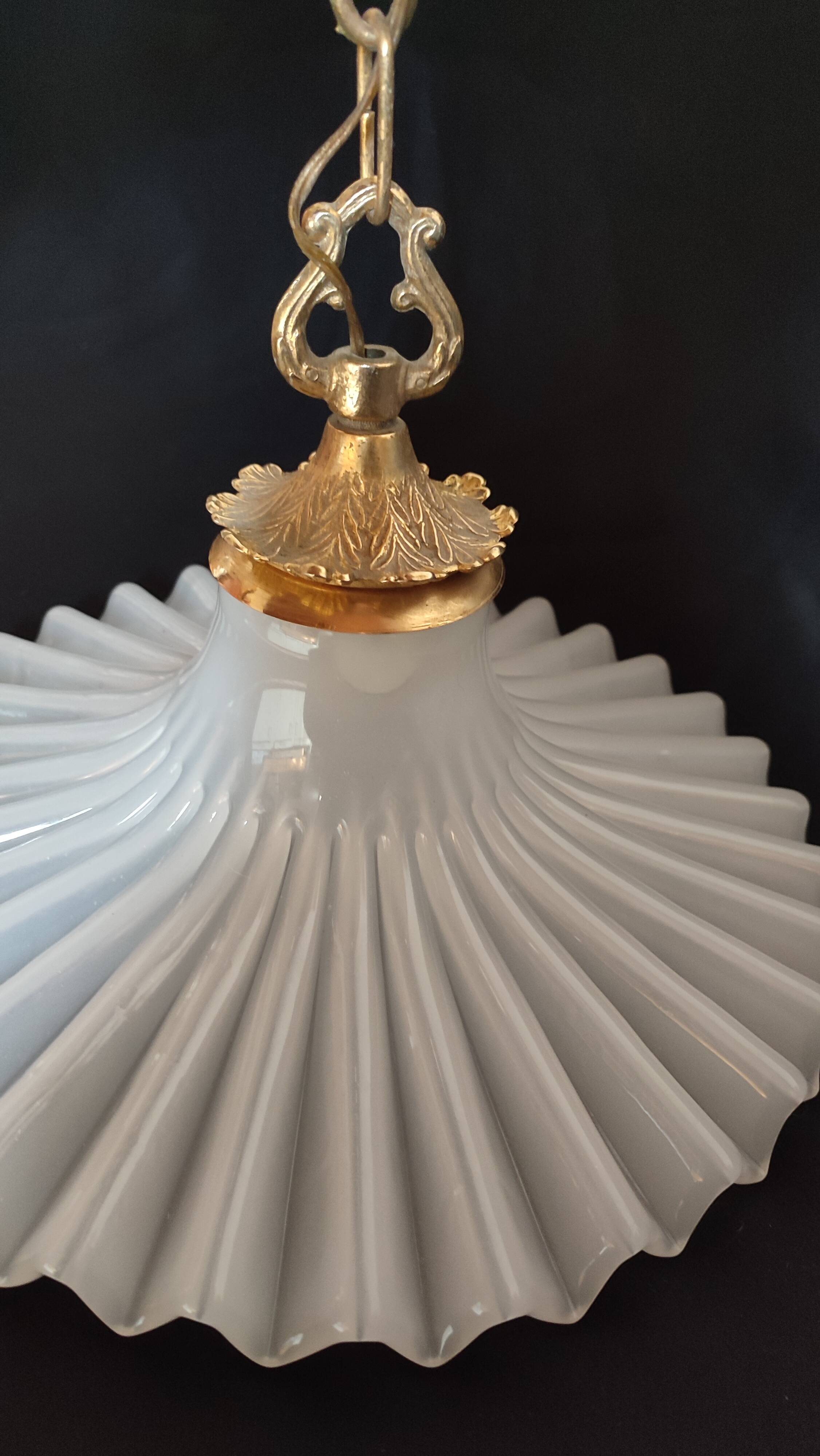 Round pendant light in pleated semi-opaque glass