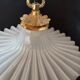 Round pendant light in pleated semi-opaque glass