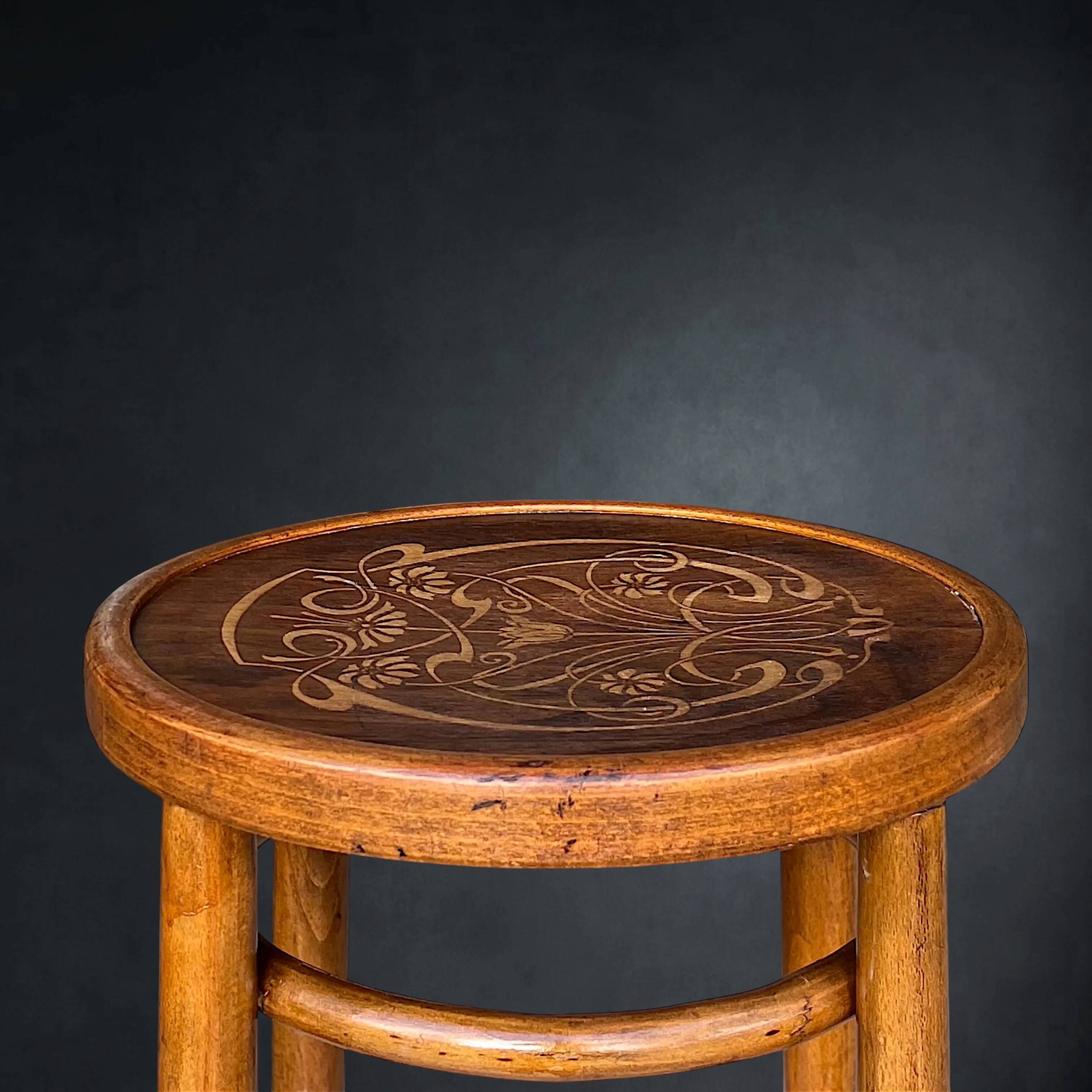 Antique high bistro stool in curved wood with a floral decorated top, Thonet style – around 1900