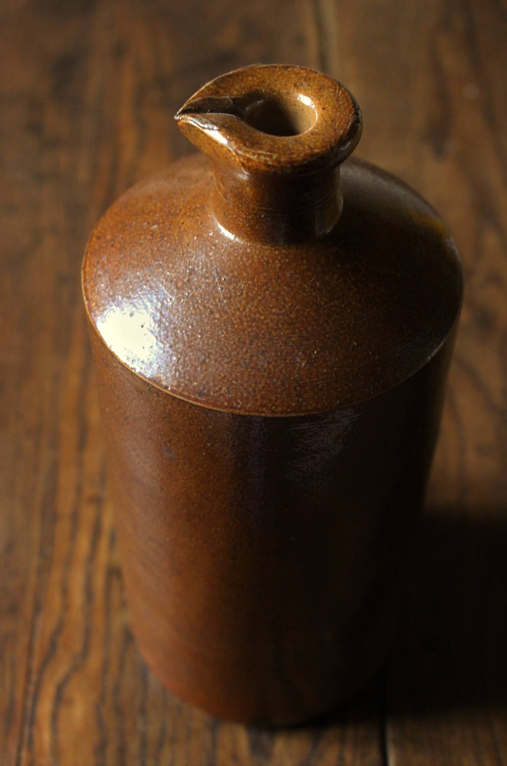Vintage Bourne Deney stoneware liqueur bottle with pouring spout.