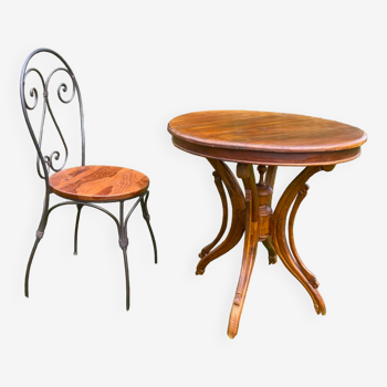 Round table and wrought iron chair