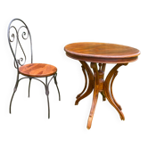 Round table and wrought iron chair