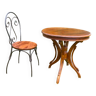 Round table and wrought iron chair