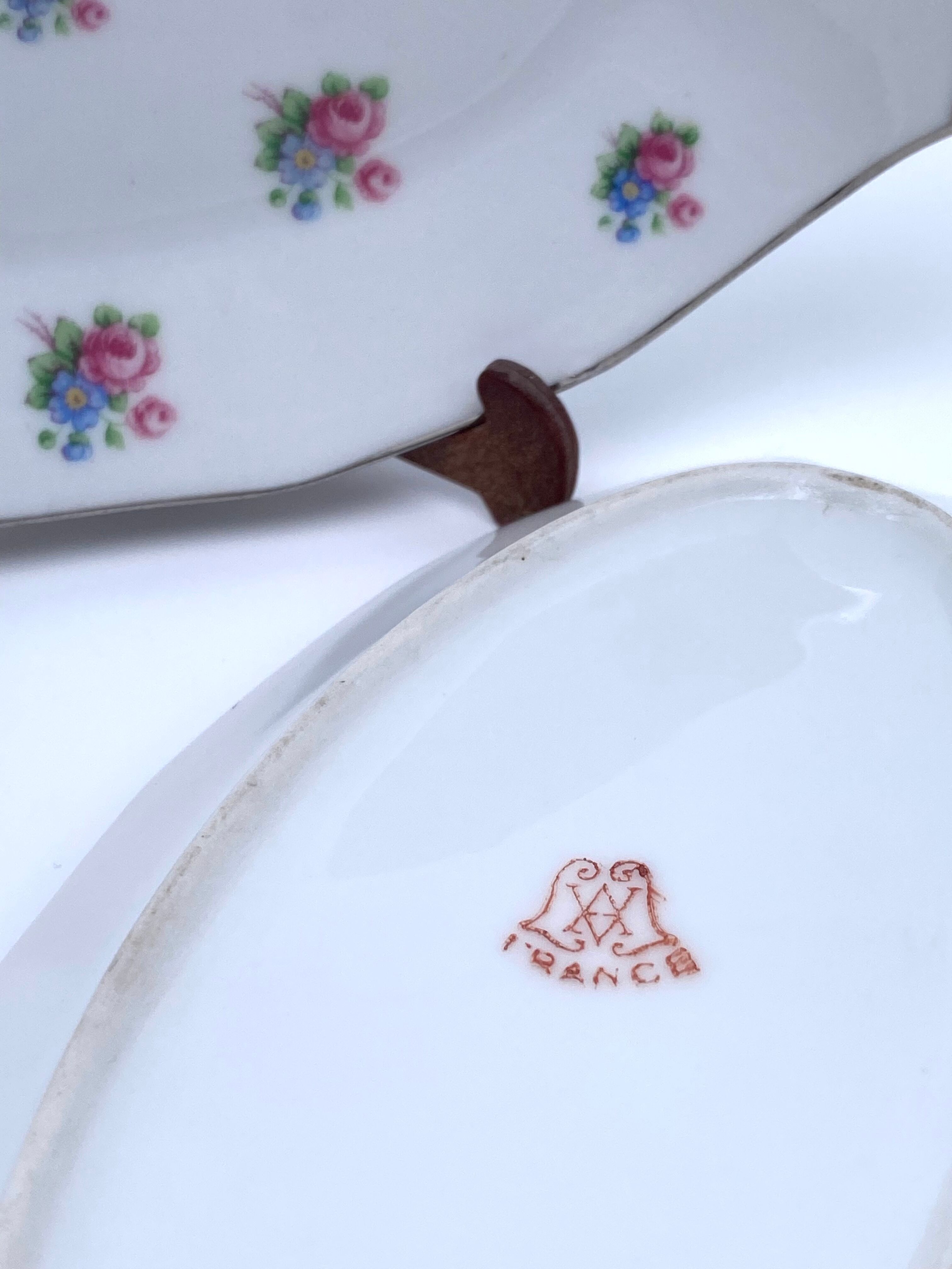 Porcelain serving dishes with small flowers and silver edging and