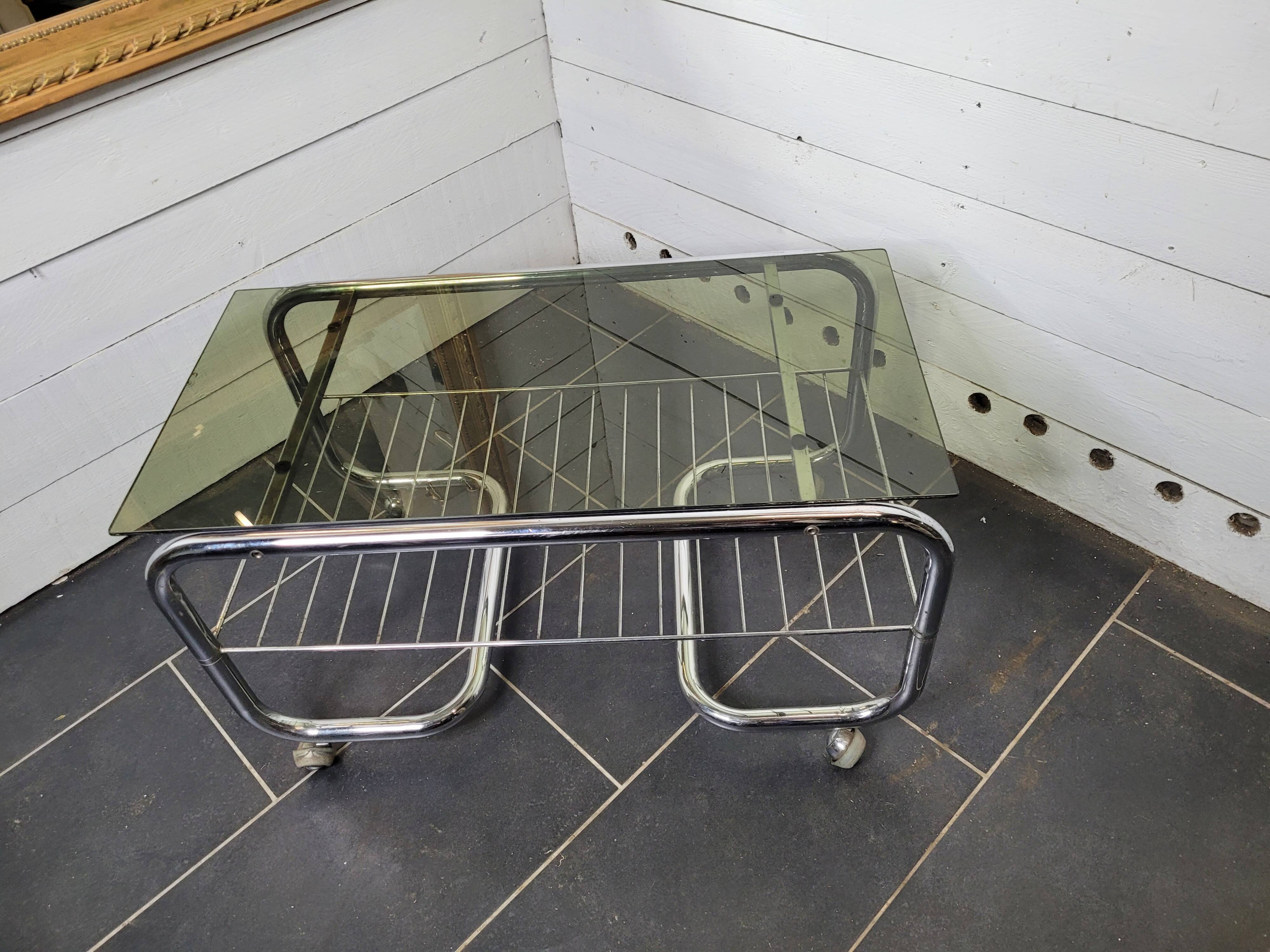 Coffee table with chrome base and smoked glass from the 70s