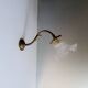 Bronze and pressed glass wall light. 1940