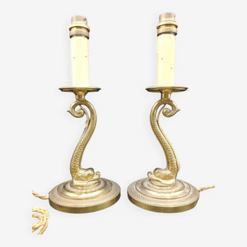 Pair of Dolphin lamp candlesticks in gilded bronze working around 1920