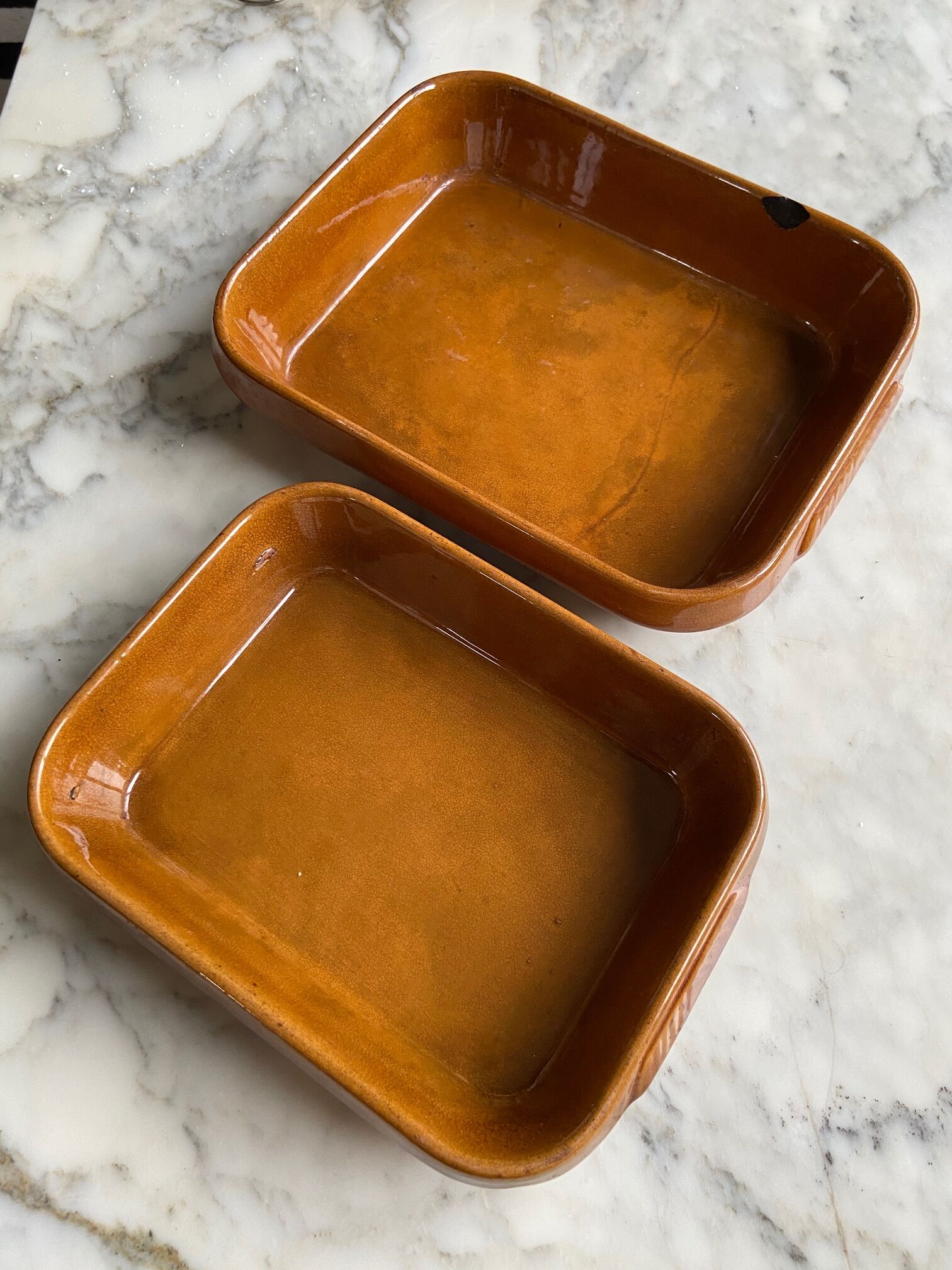 Pair of rectangular enamelled sandstone dishes