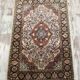 Handmade Persian carpet in wool and silk.