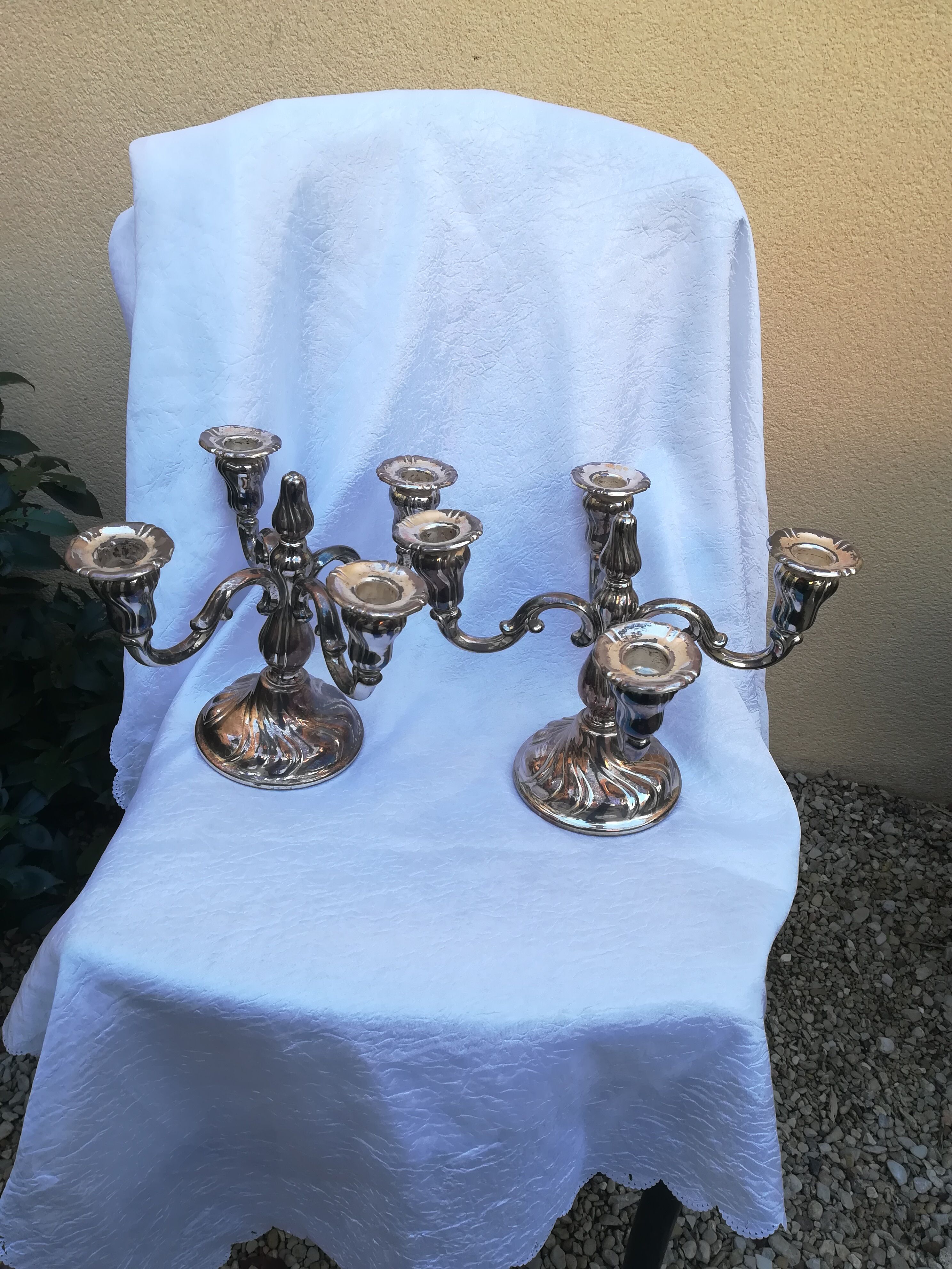 Pair of candlesticks in silver metal
