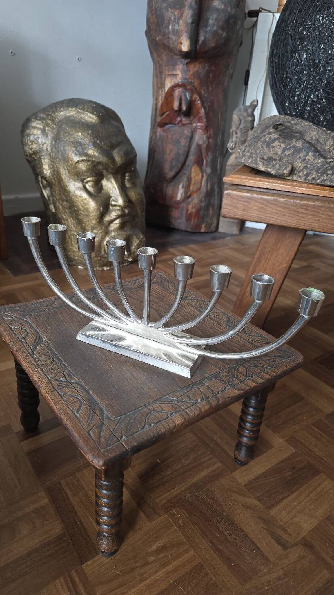 Large modern chrome metal candlestick for Hanukkah.
