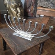 Large modern chrome metal candlestick for Hanukkah.