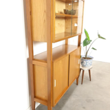 Vintage wooden showcase with sliding doors and white handles