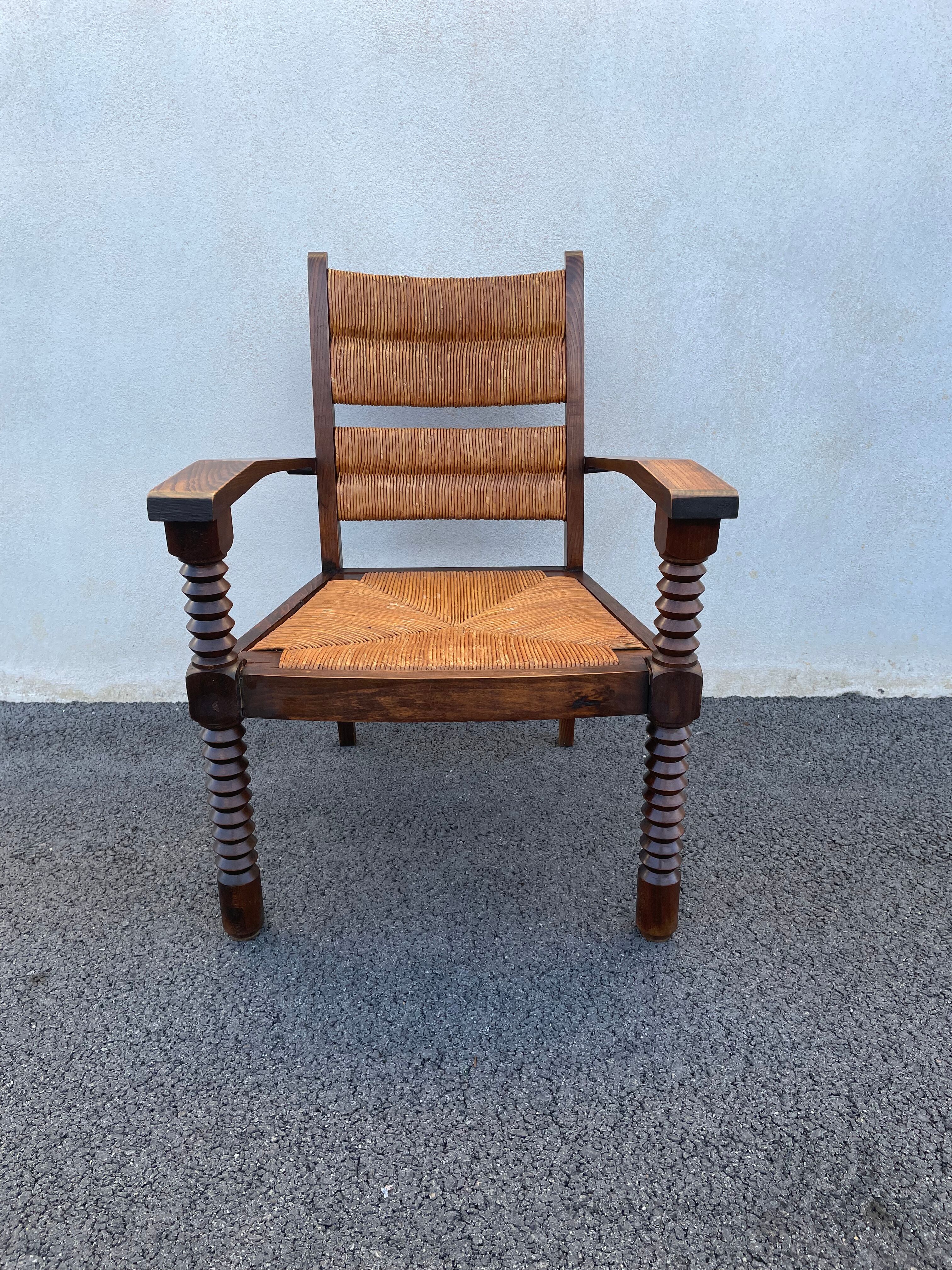 Vintage armchair in straw and brutalist wood