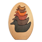 Vintage wooden puzzle with duck figurines.