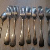 Set of 7 forks and 1 spoon in silver metal
