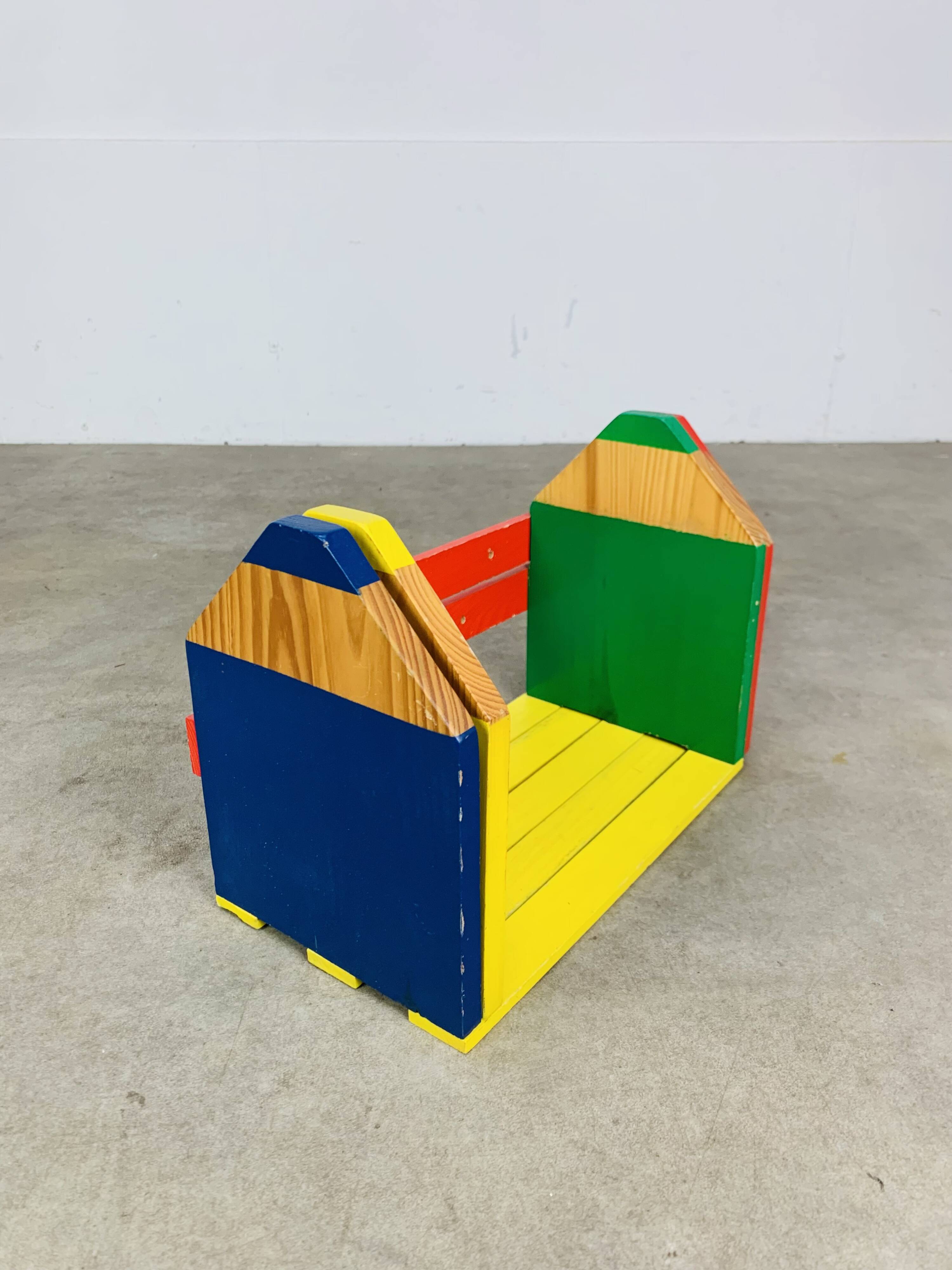 Modular wall-mounted pencil shelf in Pierre Sala style, for children.
