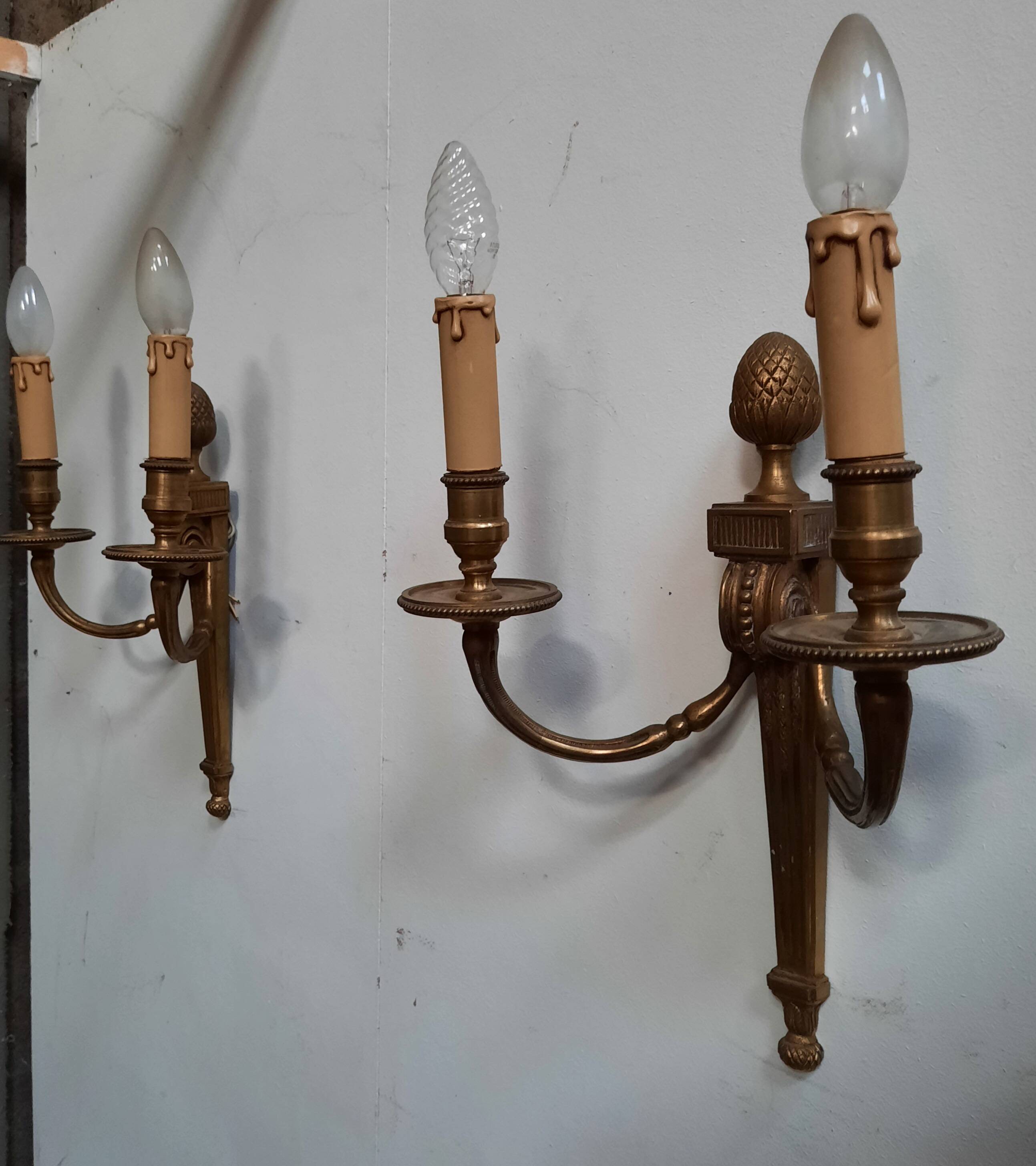 Pair of Louis XVI style bronze wall lights