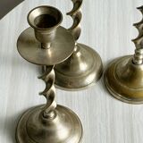 Three metal candle holders, twisted design, patinated finish, vintage style.