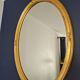 Large oval mirror gilded wood with red plate 44x66cm