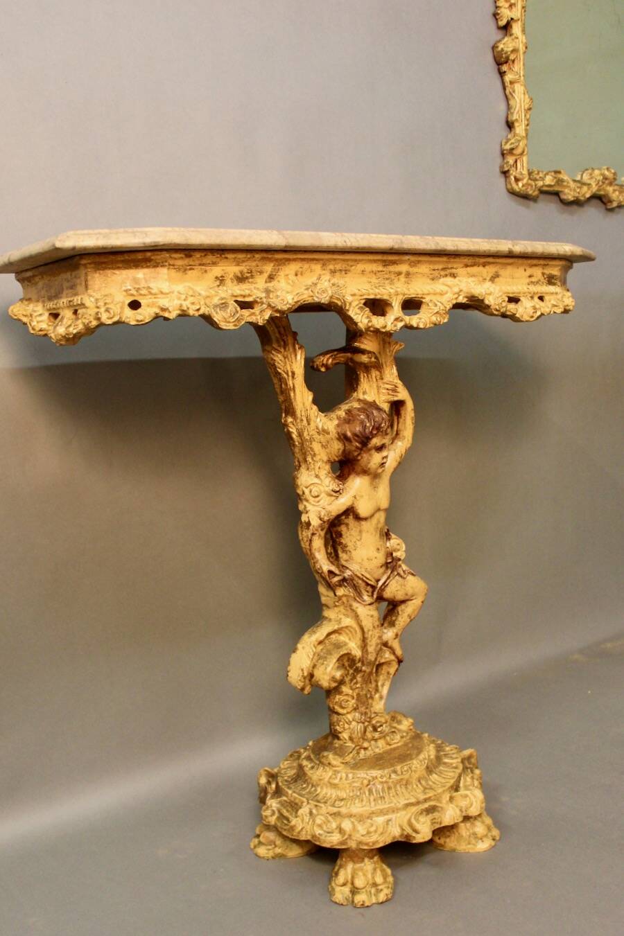 Marble top console and its rocaille style mirror
