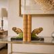 Art Deco pair of bookends with ram's heads, patinated metal and black marble.
