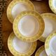 Set of 12 vintage yellow, white and gold soup plates