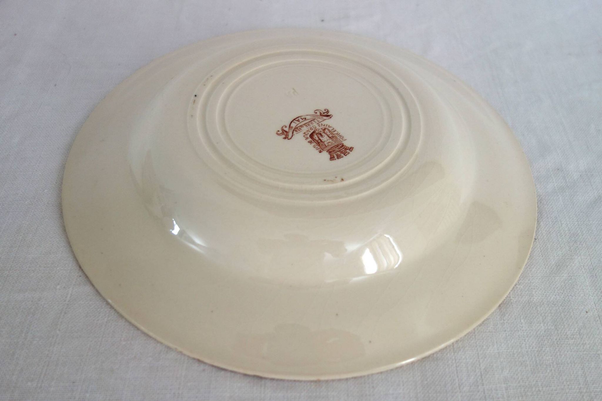 11 deep plates Terre De Fer Gien model Mai circa 1900