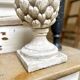 Ornamental artichoke in bleached concrete