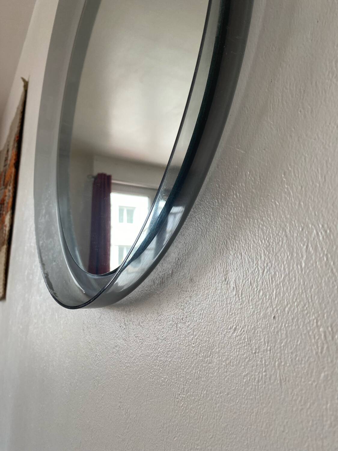 Round bluish plexiglass mirror