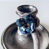 Ceramic candle holder with flower decor