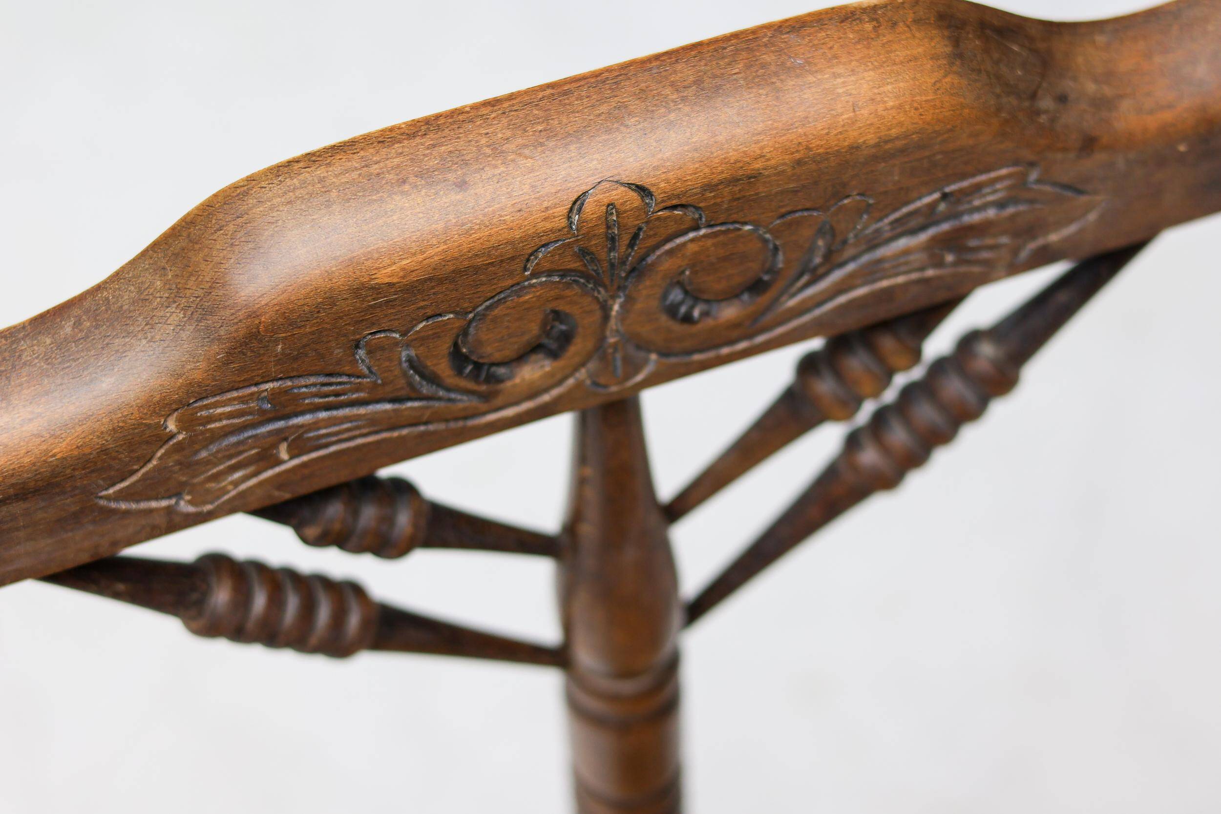 Mid Century Antiques spindle wood chaise with a rush seat.