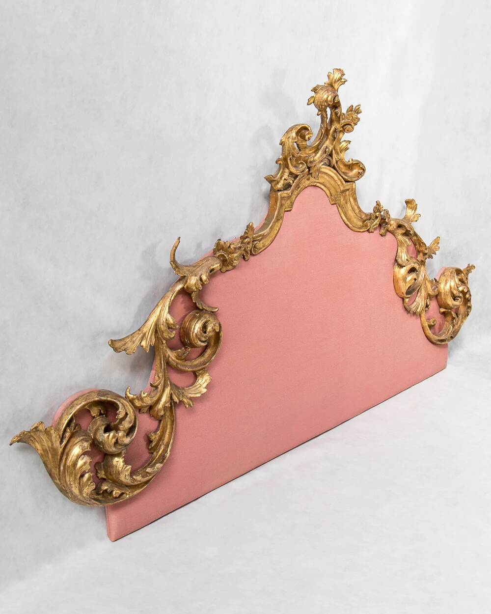 Italian rococo-style headboard in carved gilded wood, 19th century.