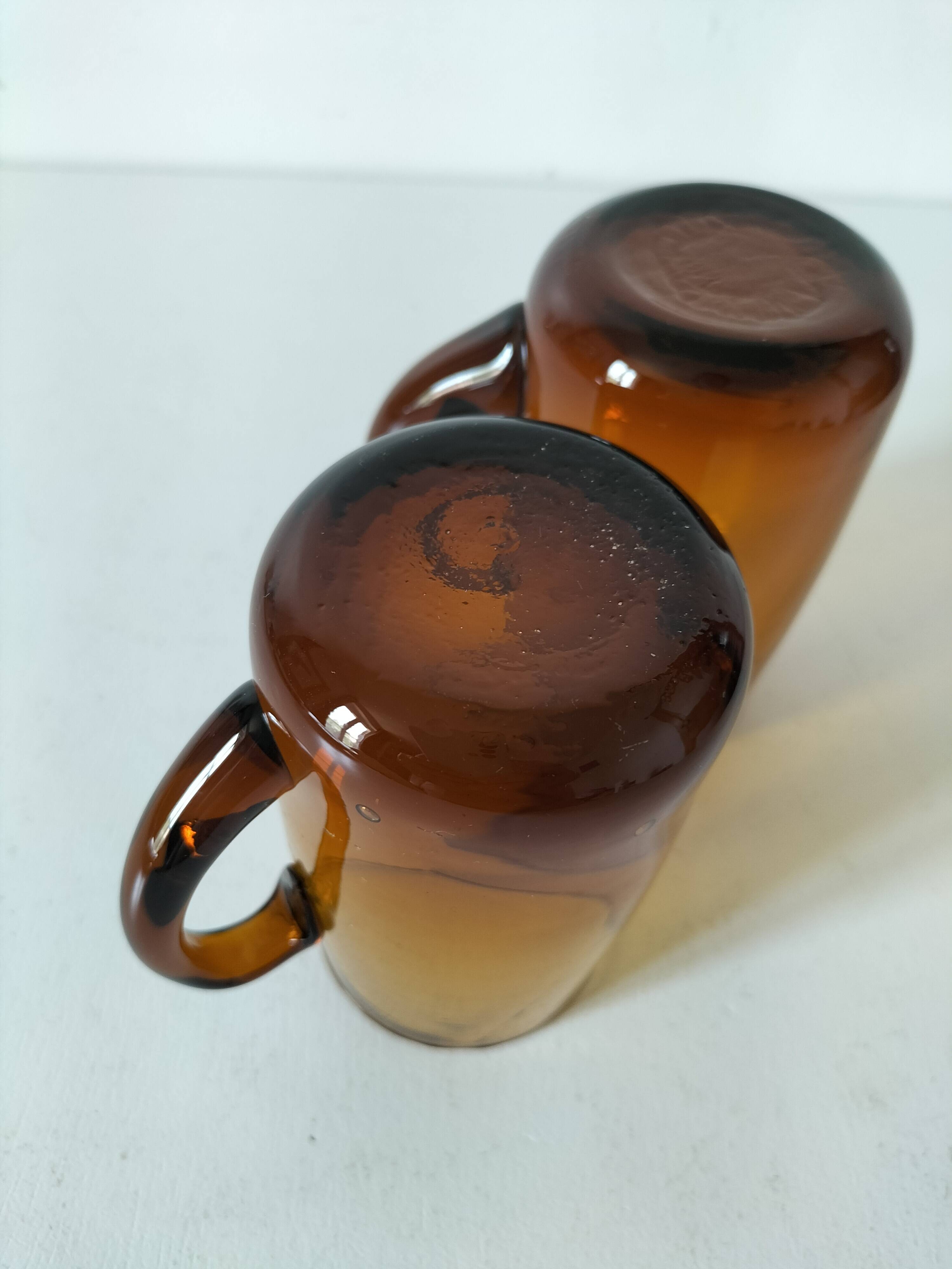 Pair of vintage amber glass tankards