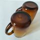 Pair of vintage amber glass tankards