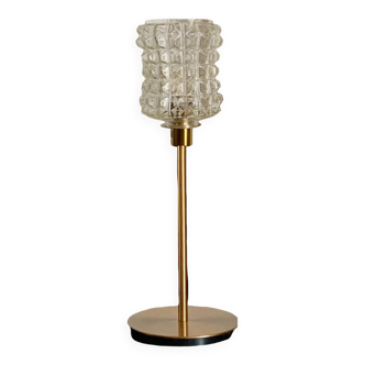Table lamp with a vintage diamond glass lampshade and a golden foot
