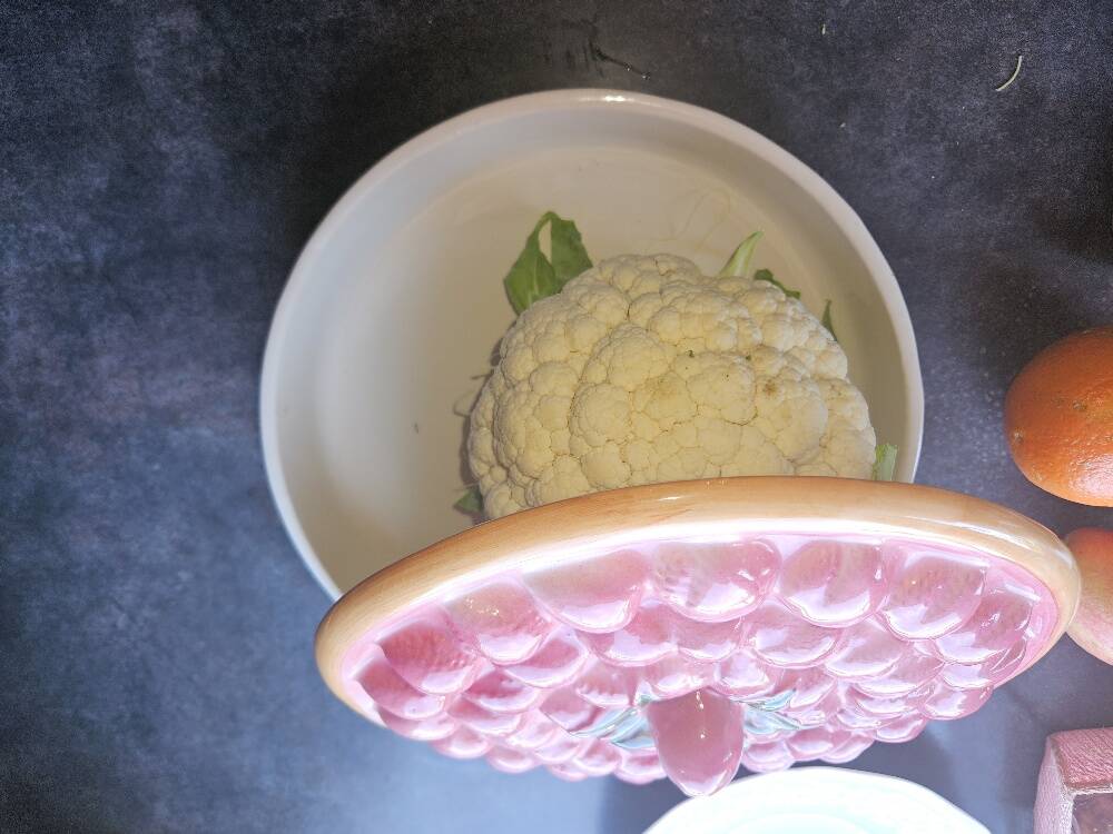 Glazed ceramic dessert plate with strawberry design.