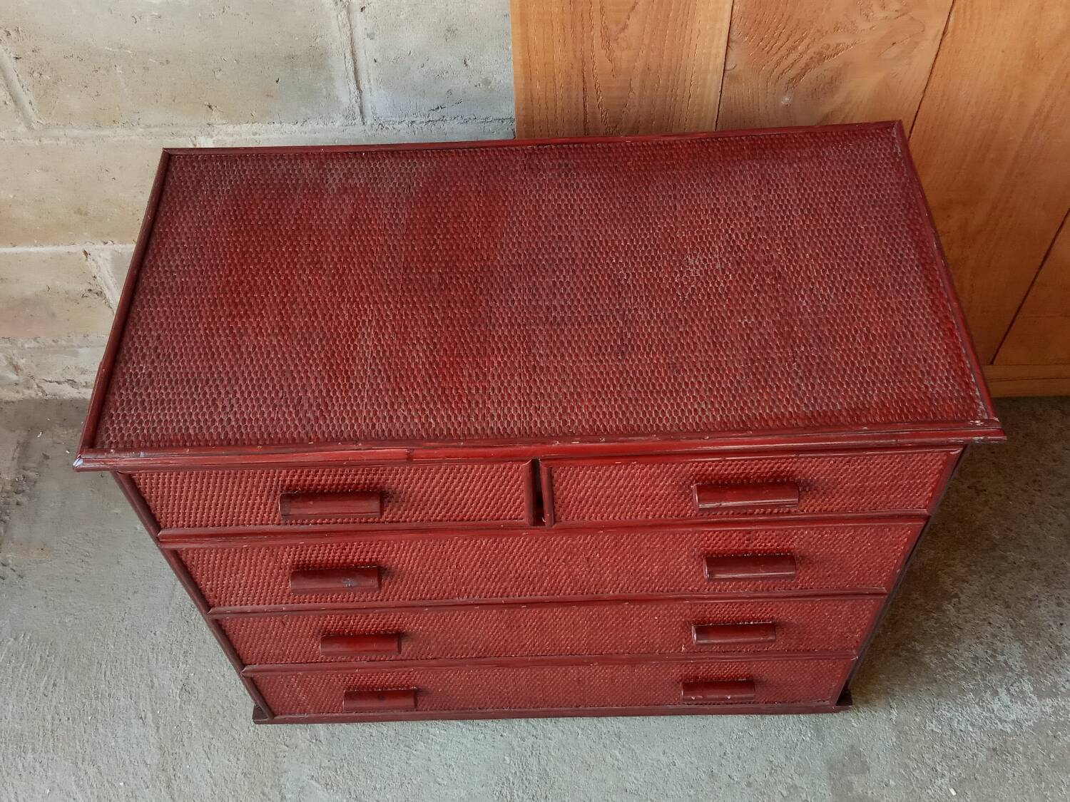 Vintage red lacquered rattan chest of drawers