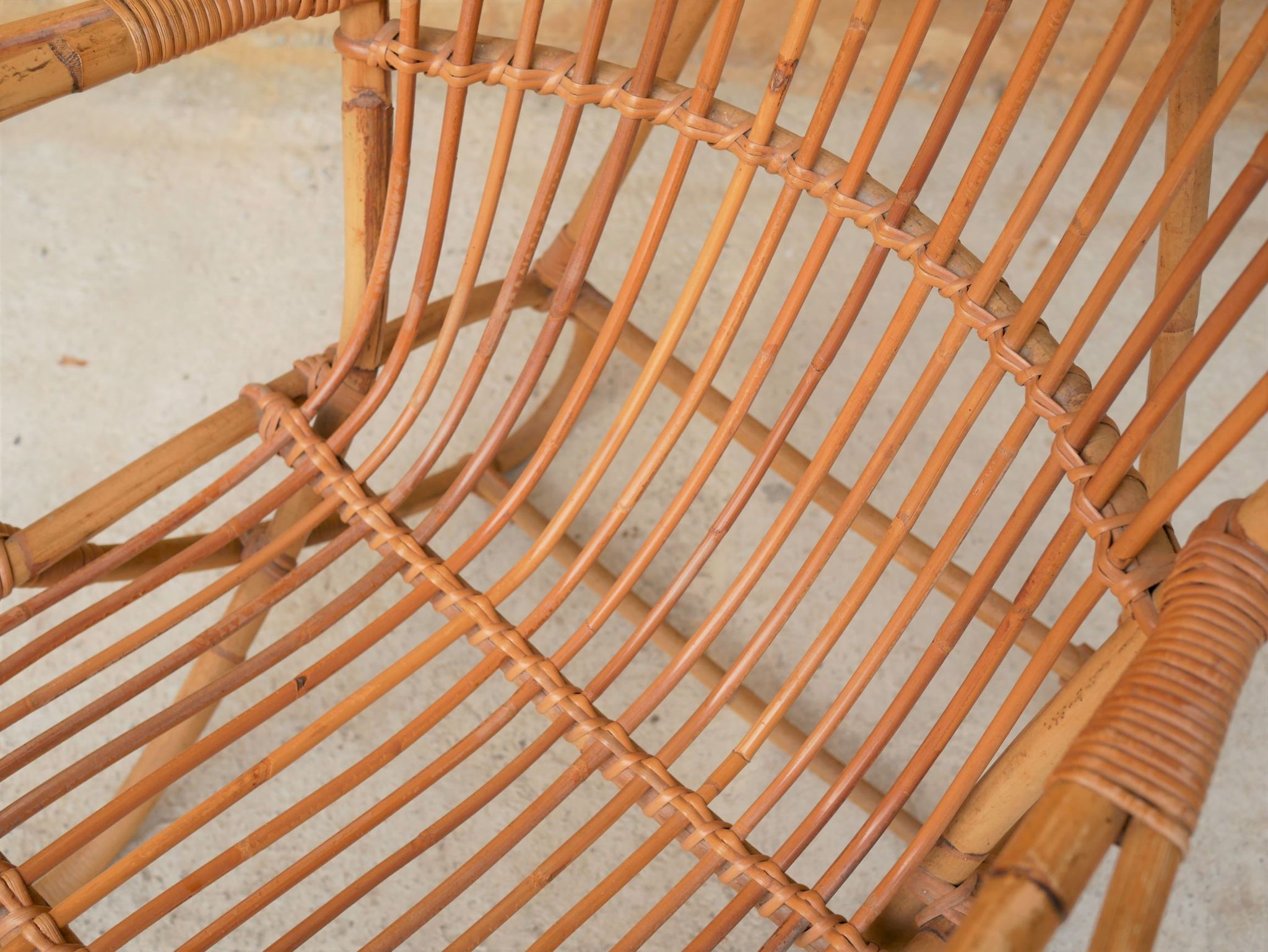 Vintage rattan chair by Louis Sognot