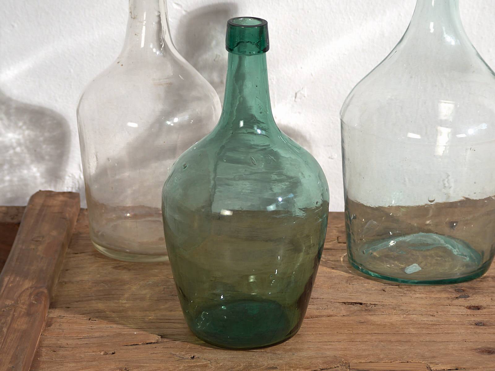 Antique colored demijohns (c.1920). Set of 3 pieces