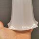 Small delicious tulip shaped hanging lamp in white opal glass with brass top.